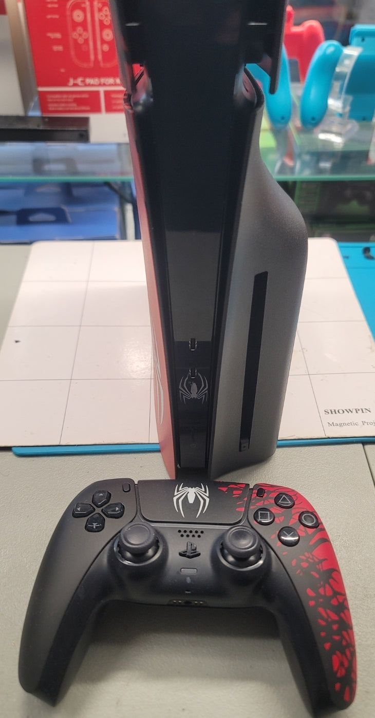 PS5 Slim Blu-Ray Edition Spider-Man Console with Spider-Man controller.